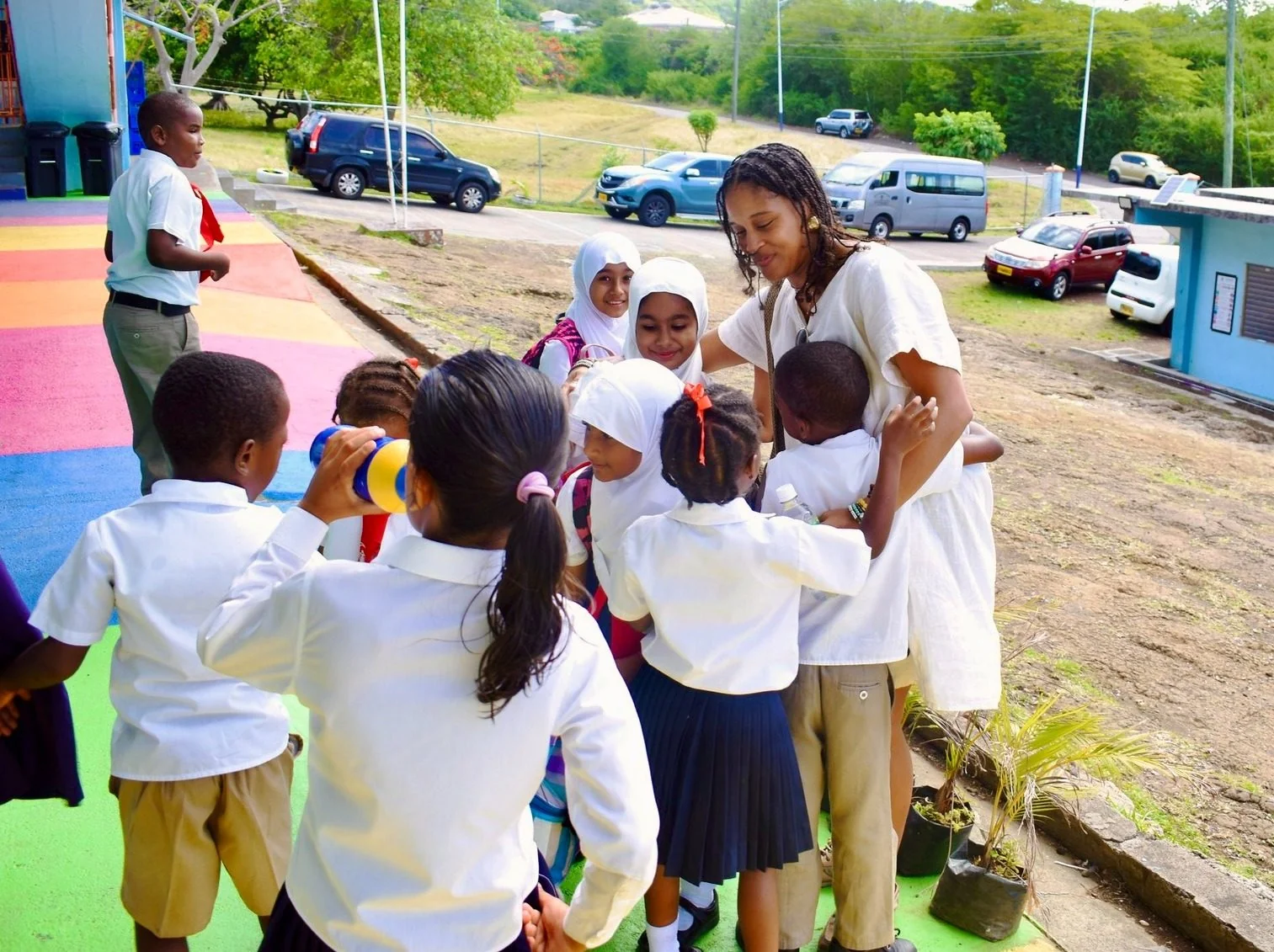 Children and volunteers taking part in an outdoor community activity.